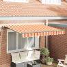 Toldo Retráctil Manual Amarillo y naranja y blanco 1